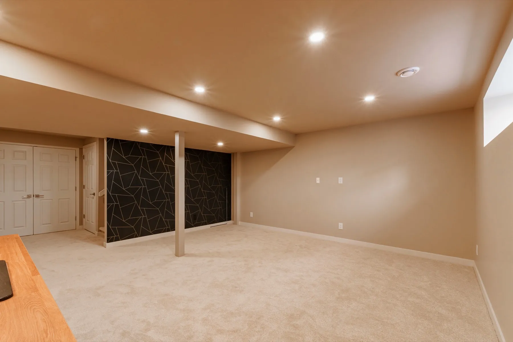 The rec room looking back to the geometric feature wall