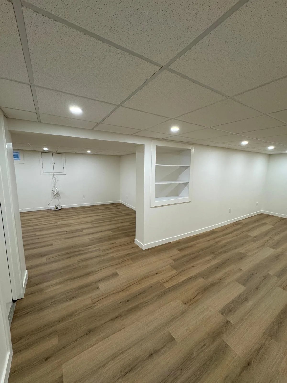 Built-in shelving recessed into the wall beside the finished floor
