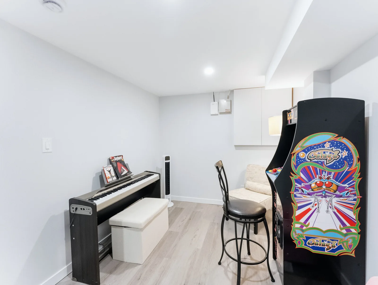 Games end with an arcade cabinet, dartboard and an upright piano