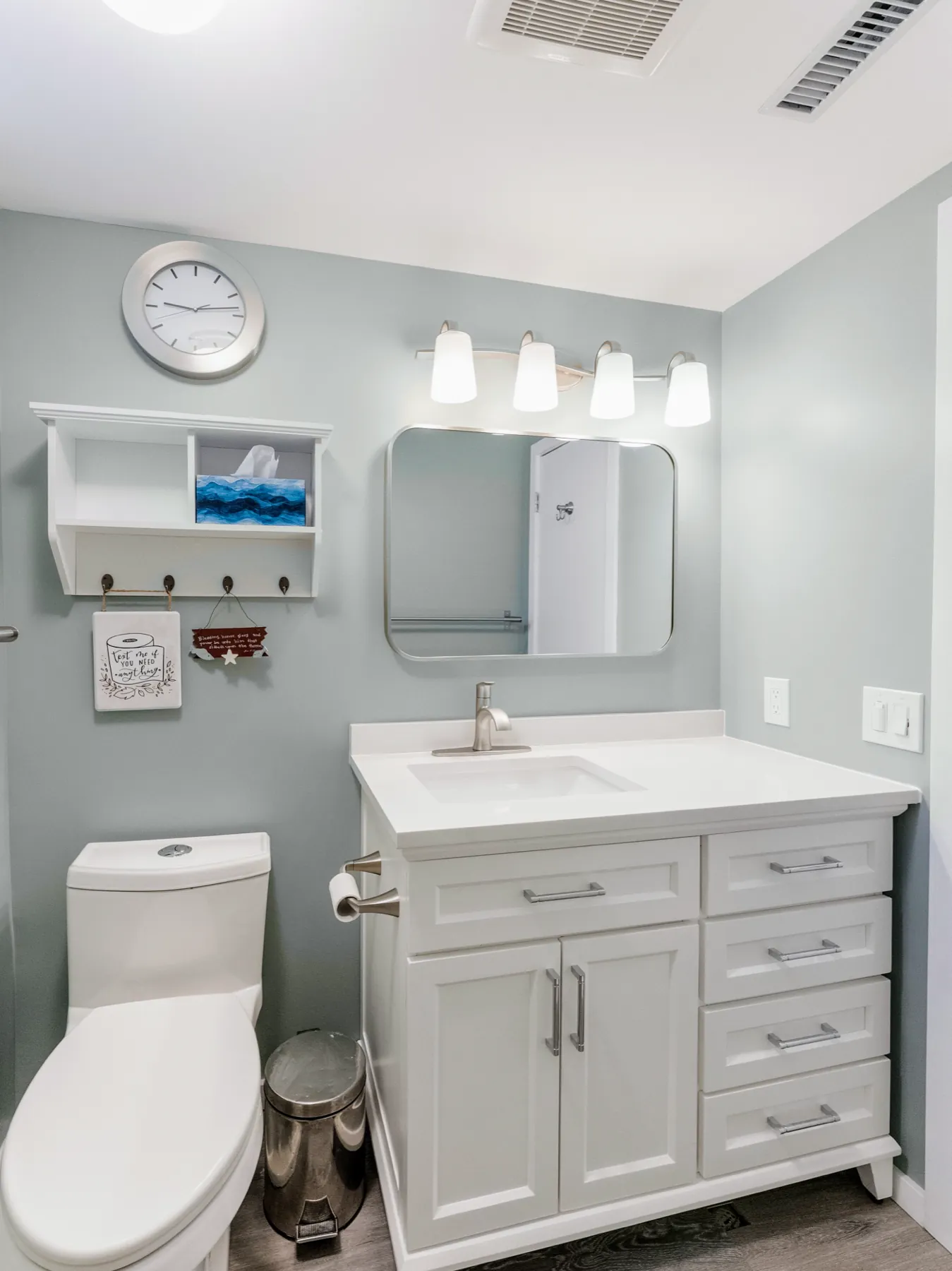 The room from the door, clearance kept wide in front of the vanity