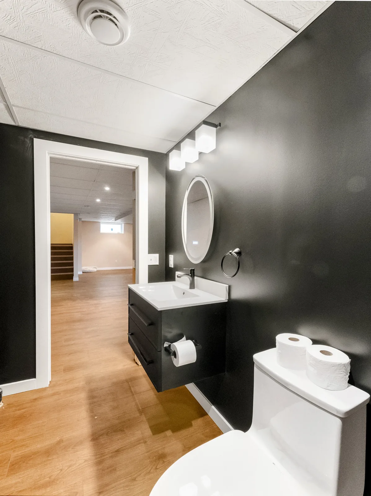 From the bathroom door, looking out across the finished lower level