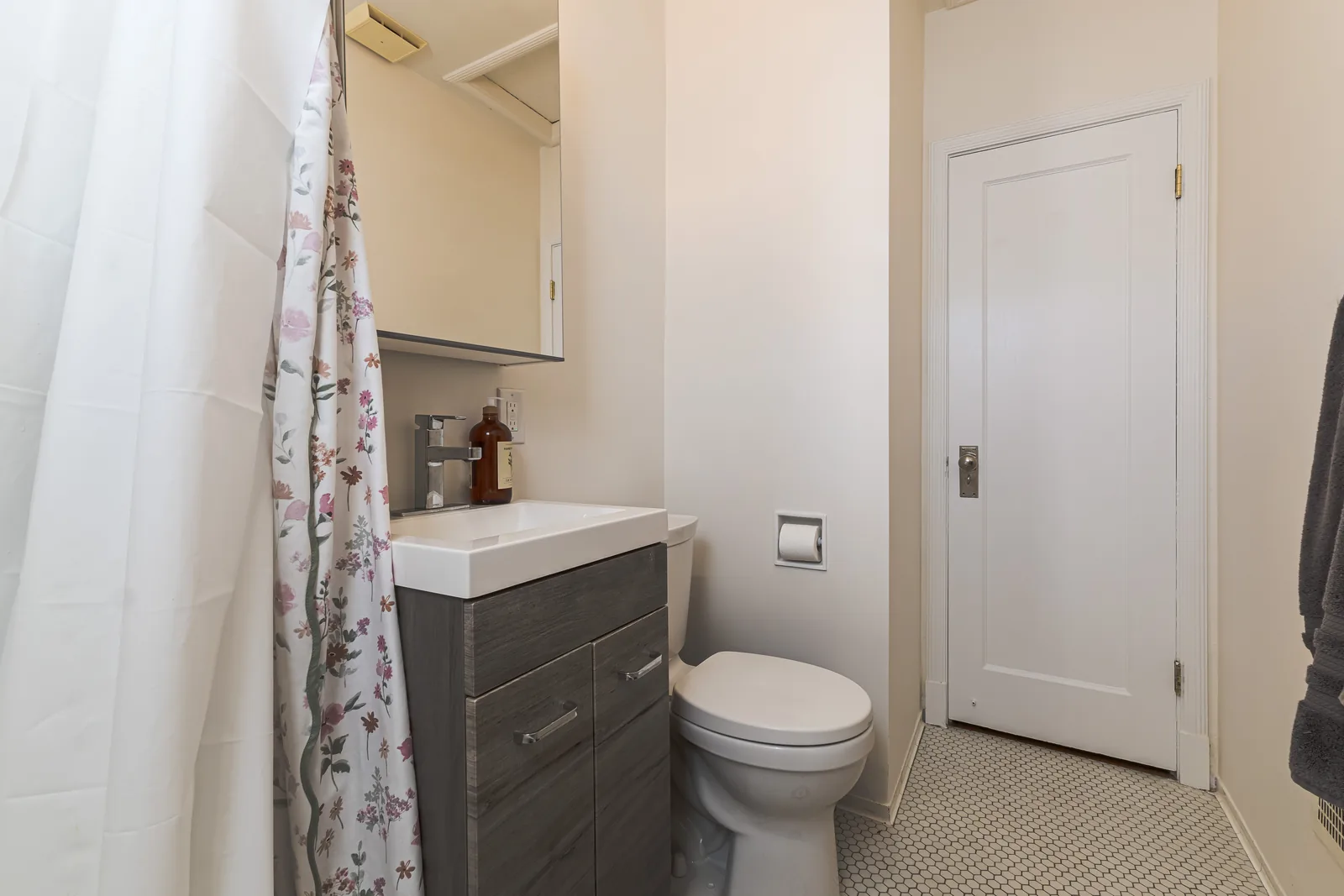 The room from the tub, door through to the hall beyond