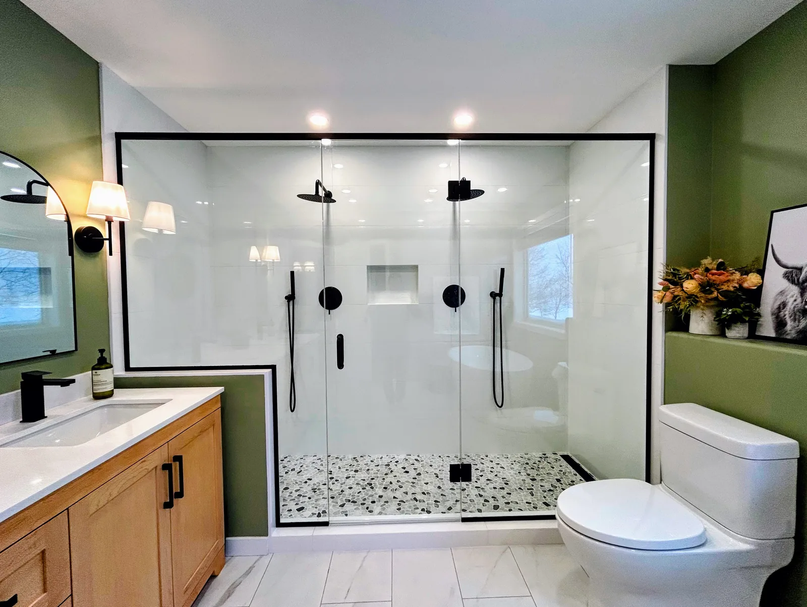 Ensuite with an oak double vanity and a full-width walk-in shower behind black-framed glass