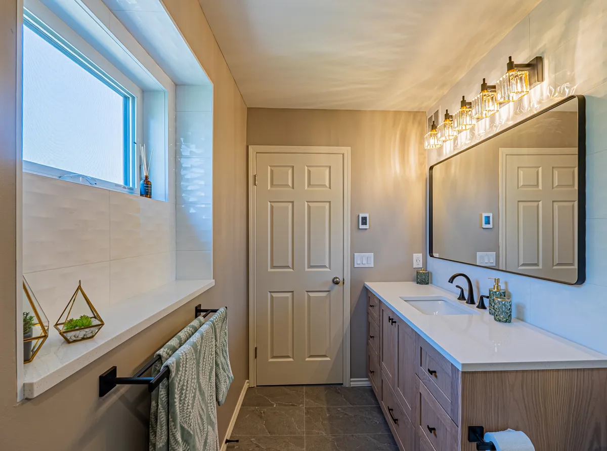 The ensuite from the window, the oak vanity running toward the door