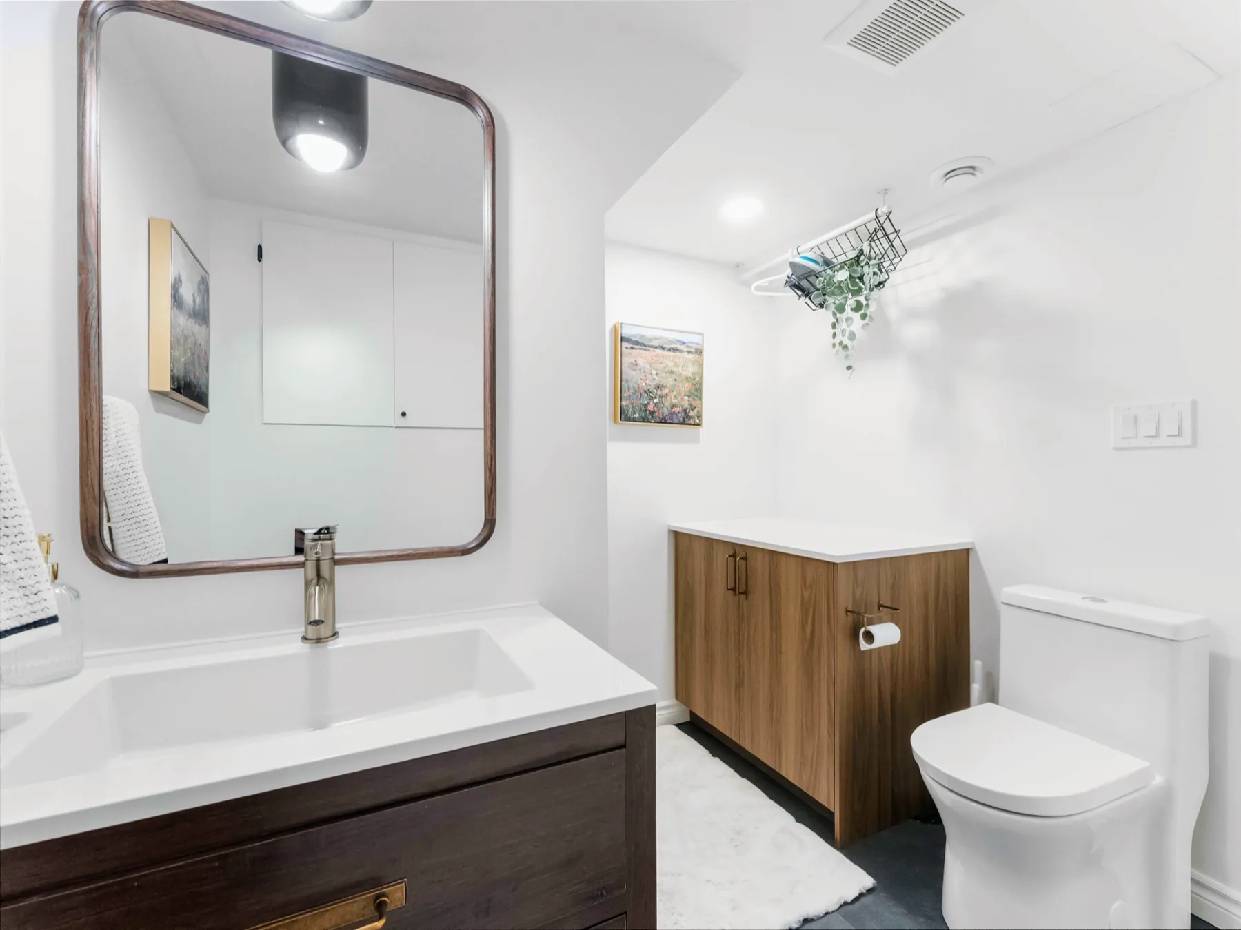 The trough basin and brass tap against the white wall
