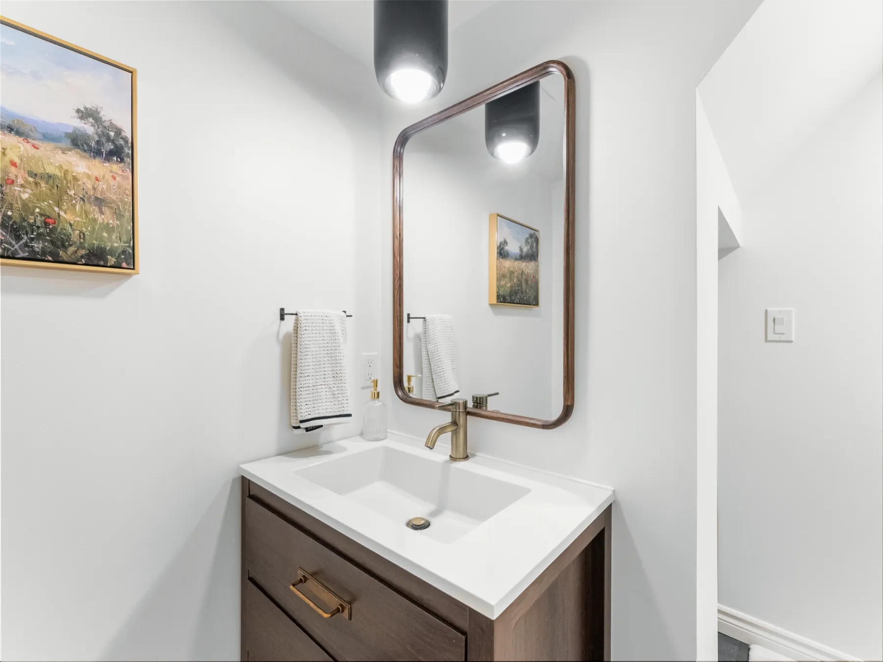 The vanity square on, mirror and pendant above