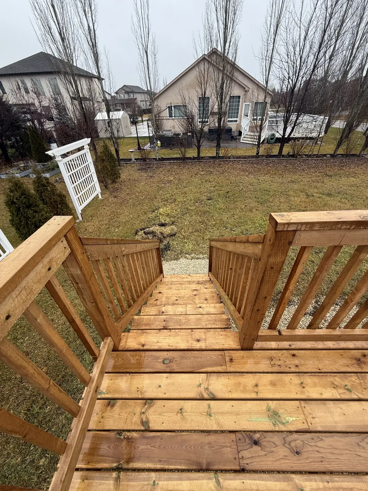 Looking down the stair from the deck to the yard