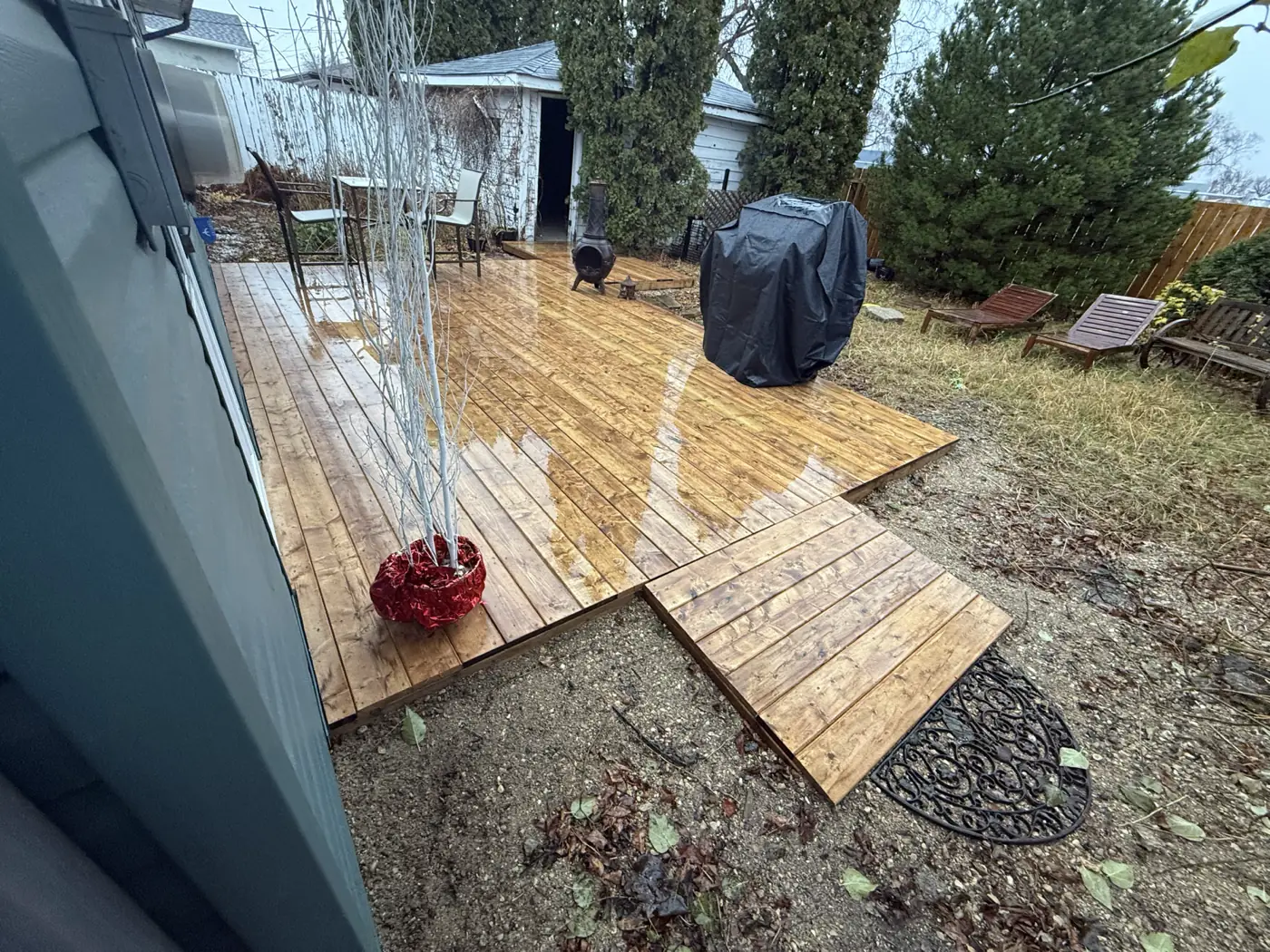 The deck along the back of the house, door onto it