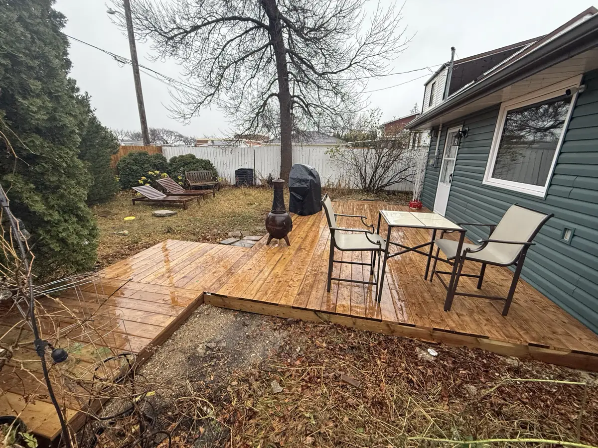 Table and chairs set out on the finished deck