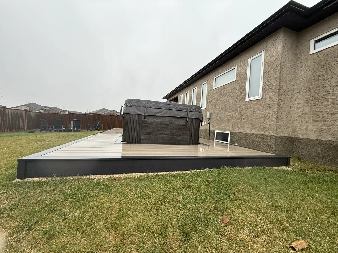 The black fascia trim running the edge of the deck