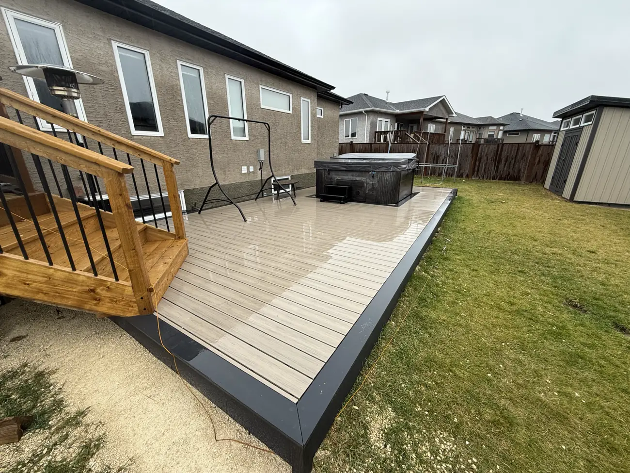 Where the new deck meets the existing raised deck and its stairs