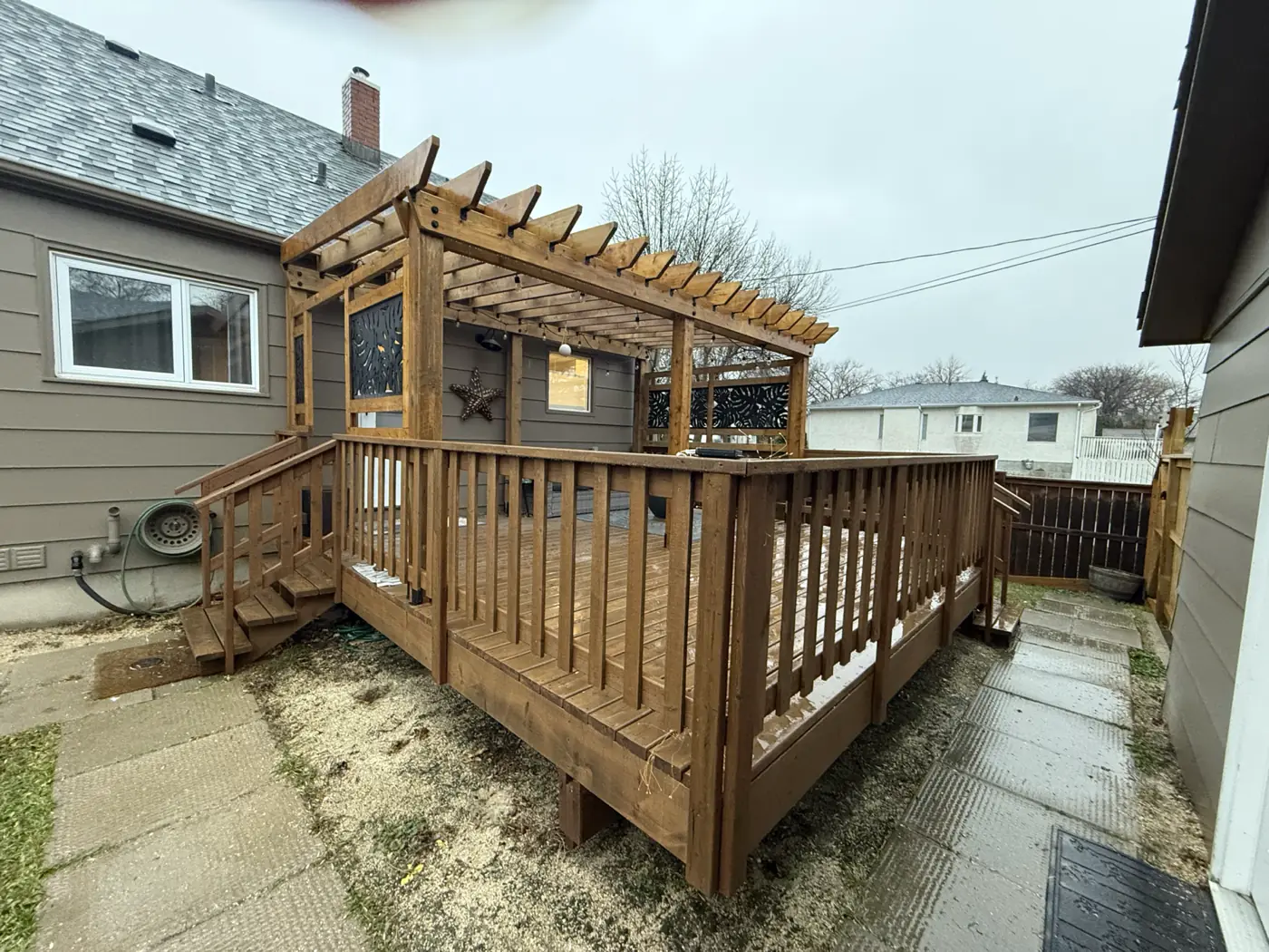 The deck and pergola from the far corner of the yard