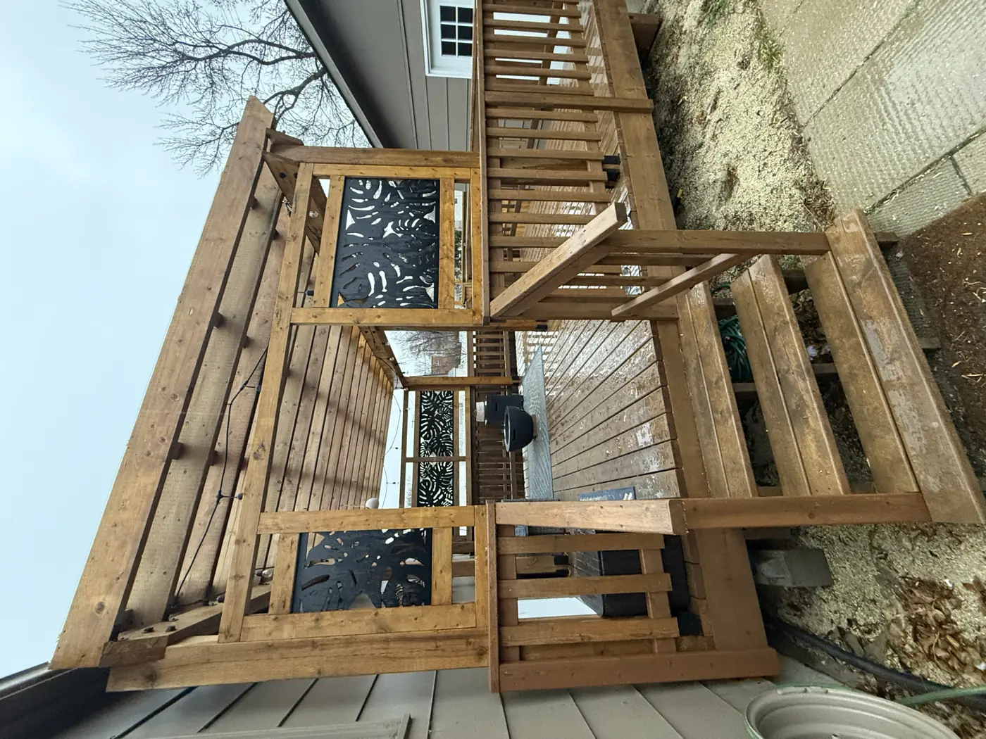 The pergola rafters and their steel connectors from below