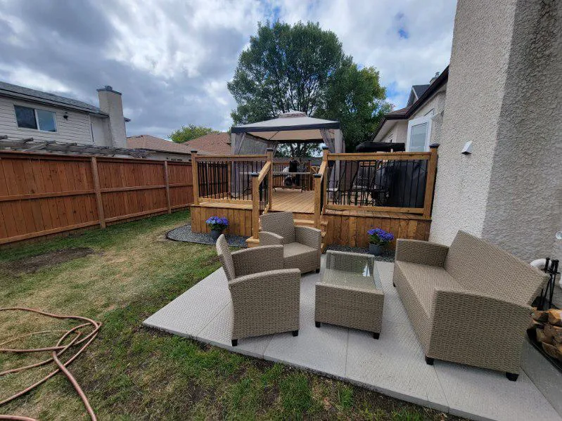 The patio looking back at the deck and its gated stair