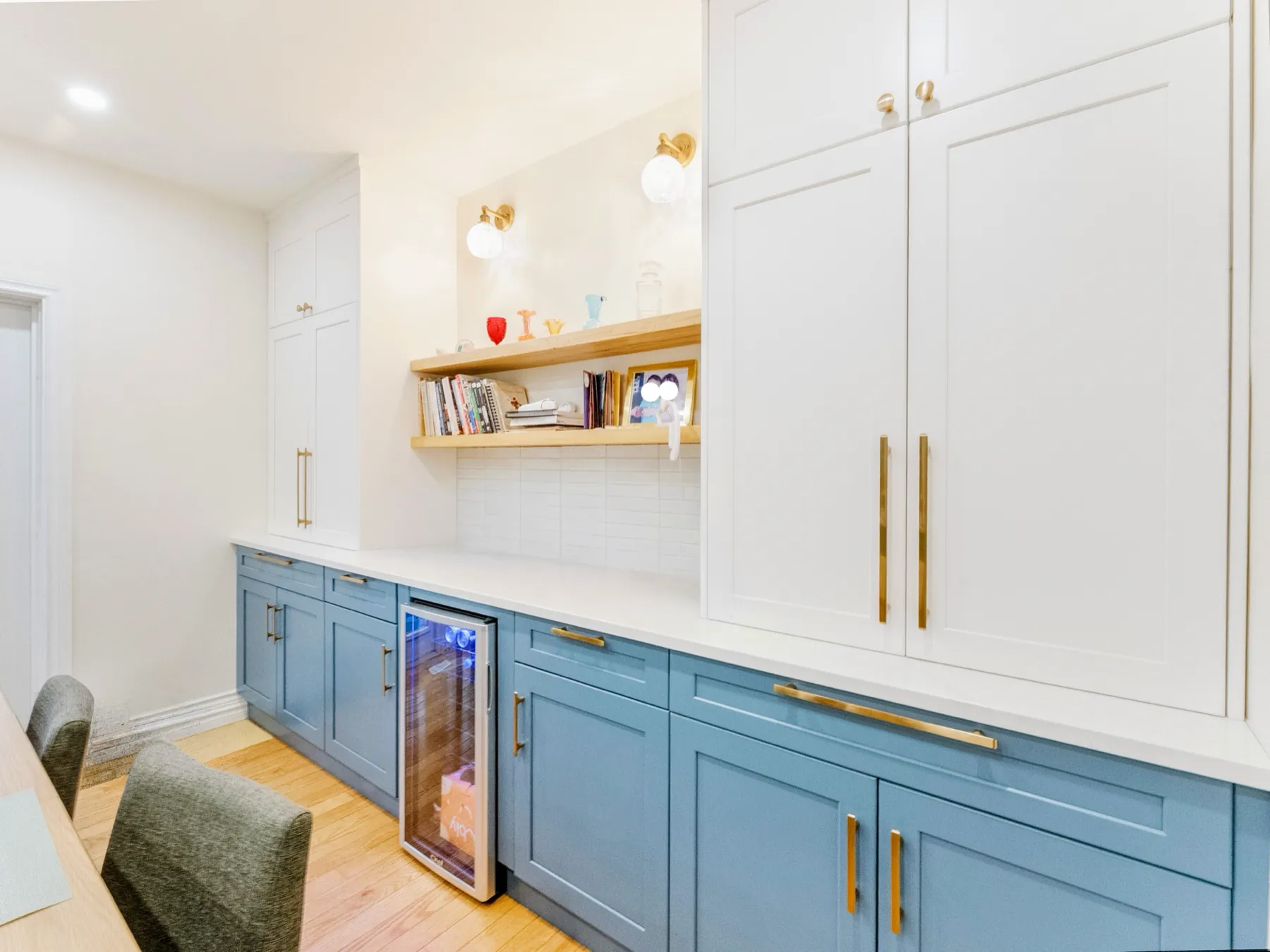 The dining-wall run with its oak shelf and built-in wine fridge