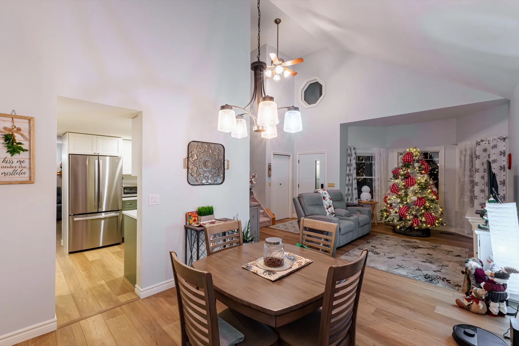 The dining table off the kitchen, the living room open beyond