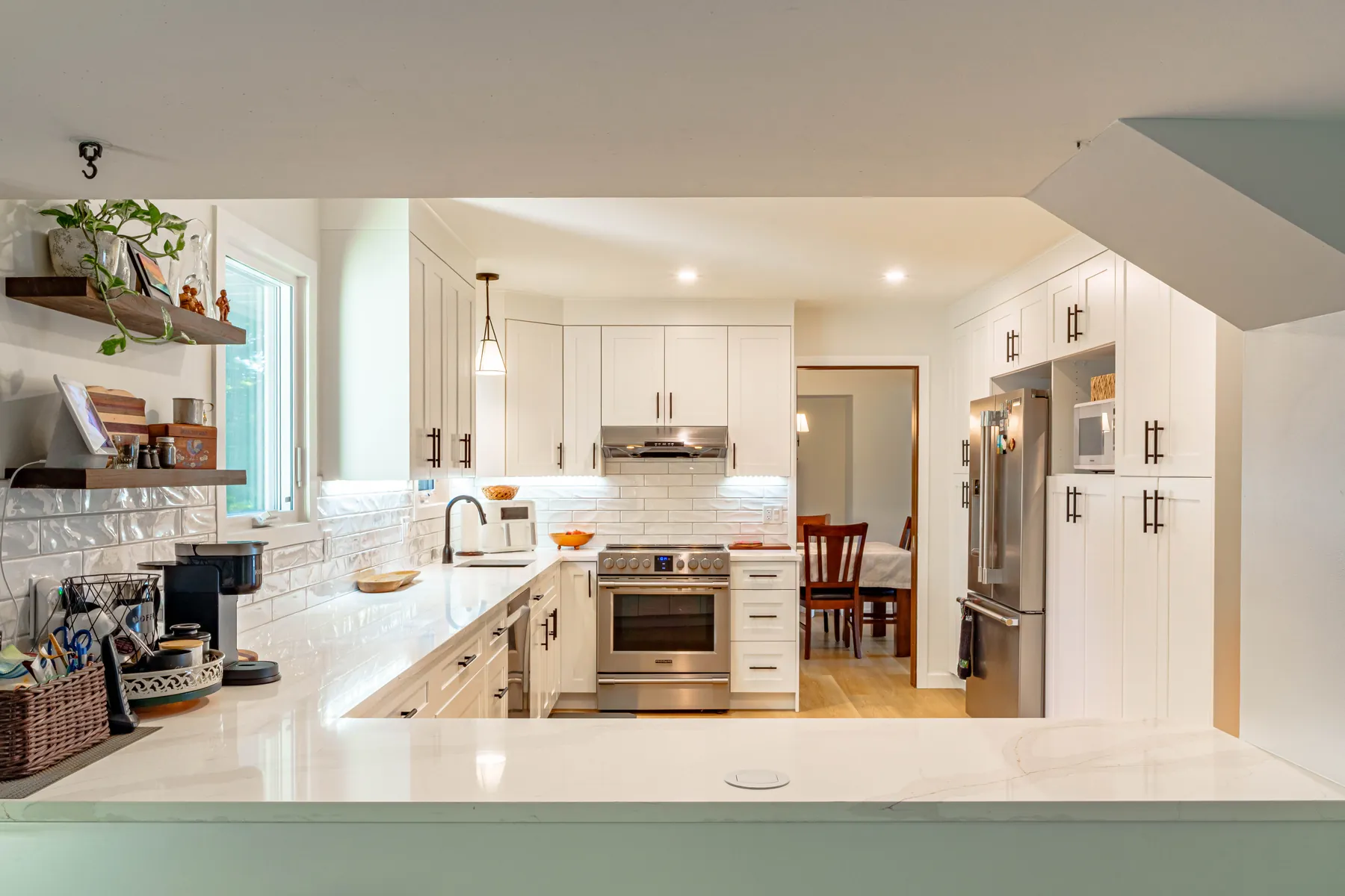 A PHS kitchen renovation in Winnipeg — custom shaker cabinetry, quartz counters and hardwood floors