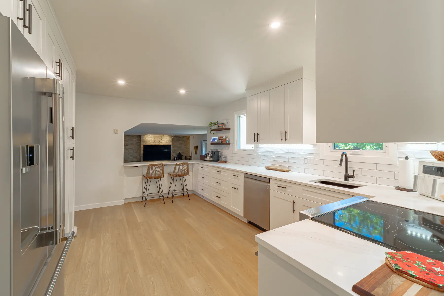 Range wall with tiled backsplash and stainless appliances