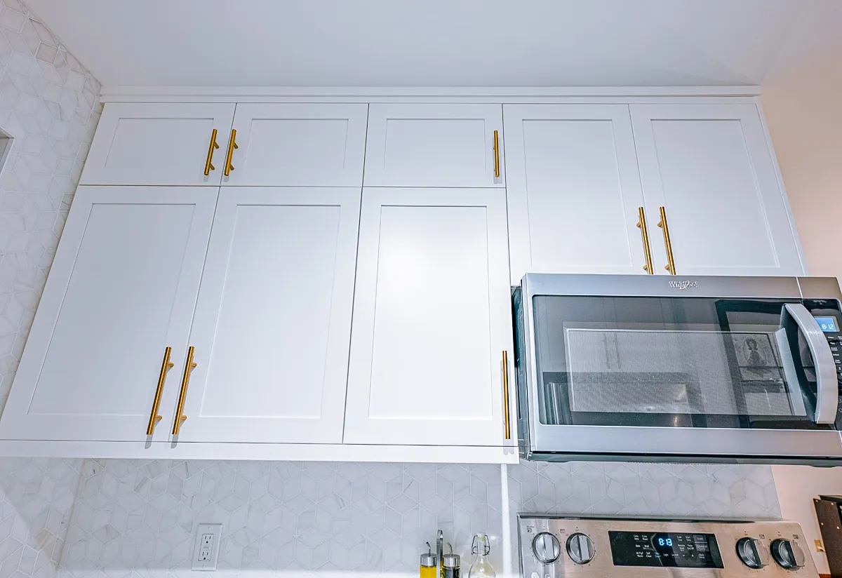 White uppers and the microwave run above the counter