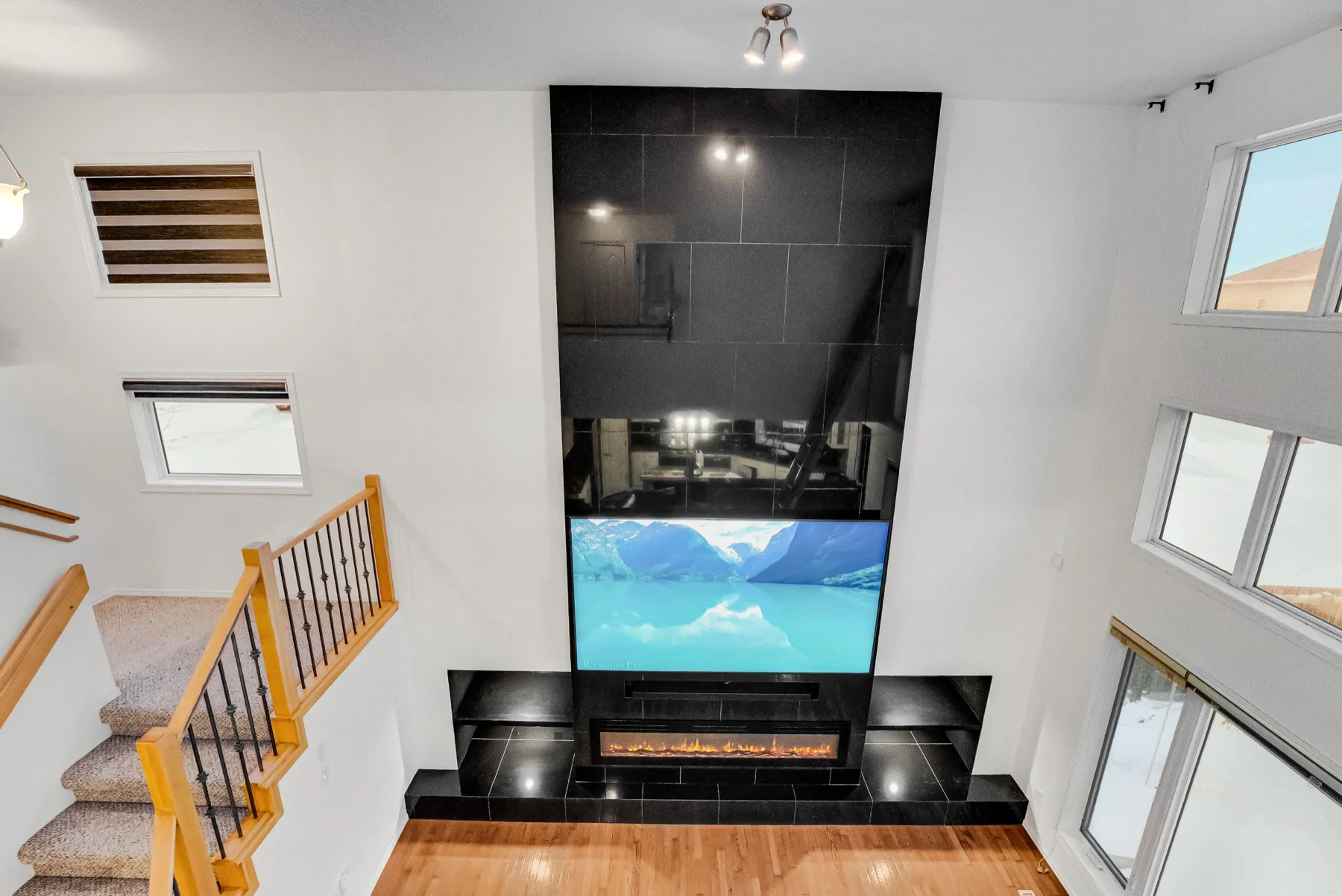 The wall from the top of the stair, the hearth stepping out onto the hardwood
