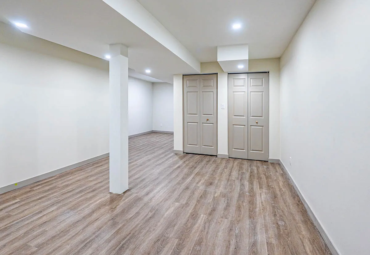 The open basement with double closet doors