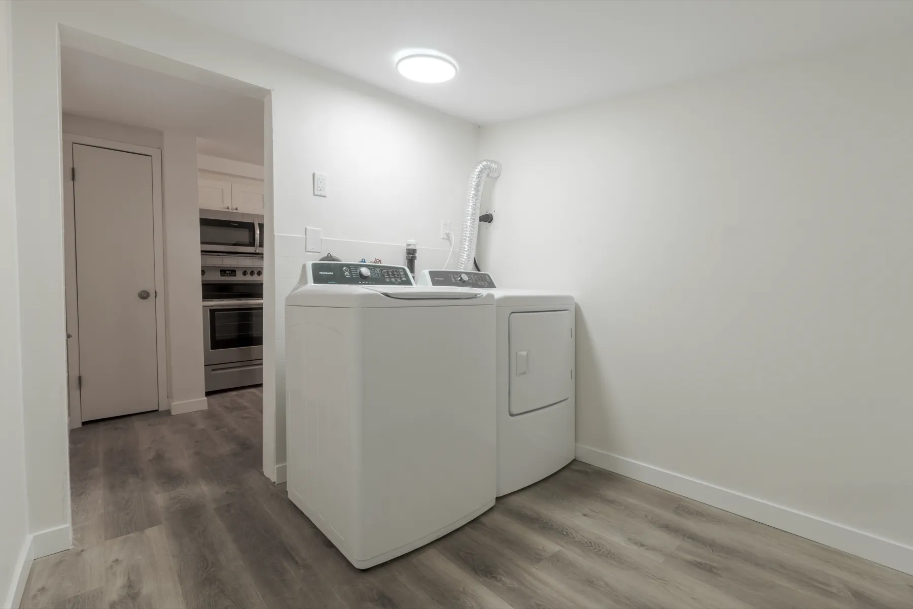 Laundry in its own room, with the kitchen through the doorway