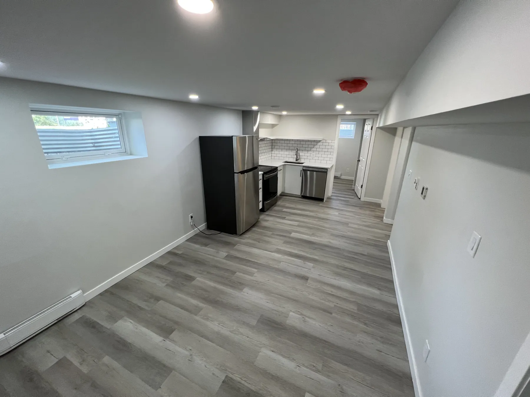 The lower level, opening through to its own kitchen