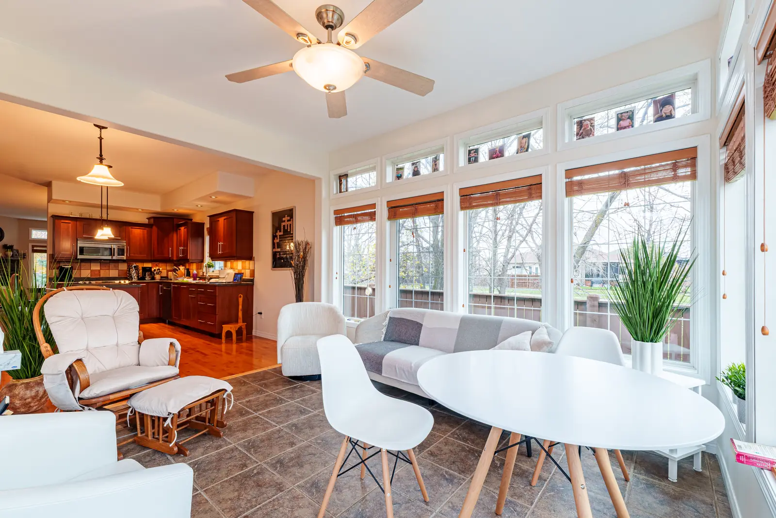 Four-season room glazed on three sides, open through to the kitchen beyond