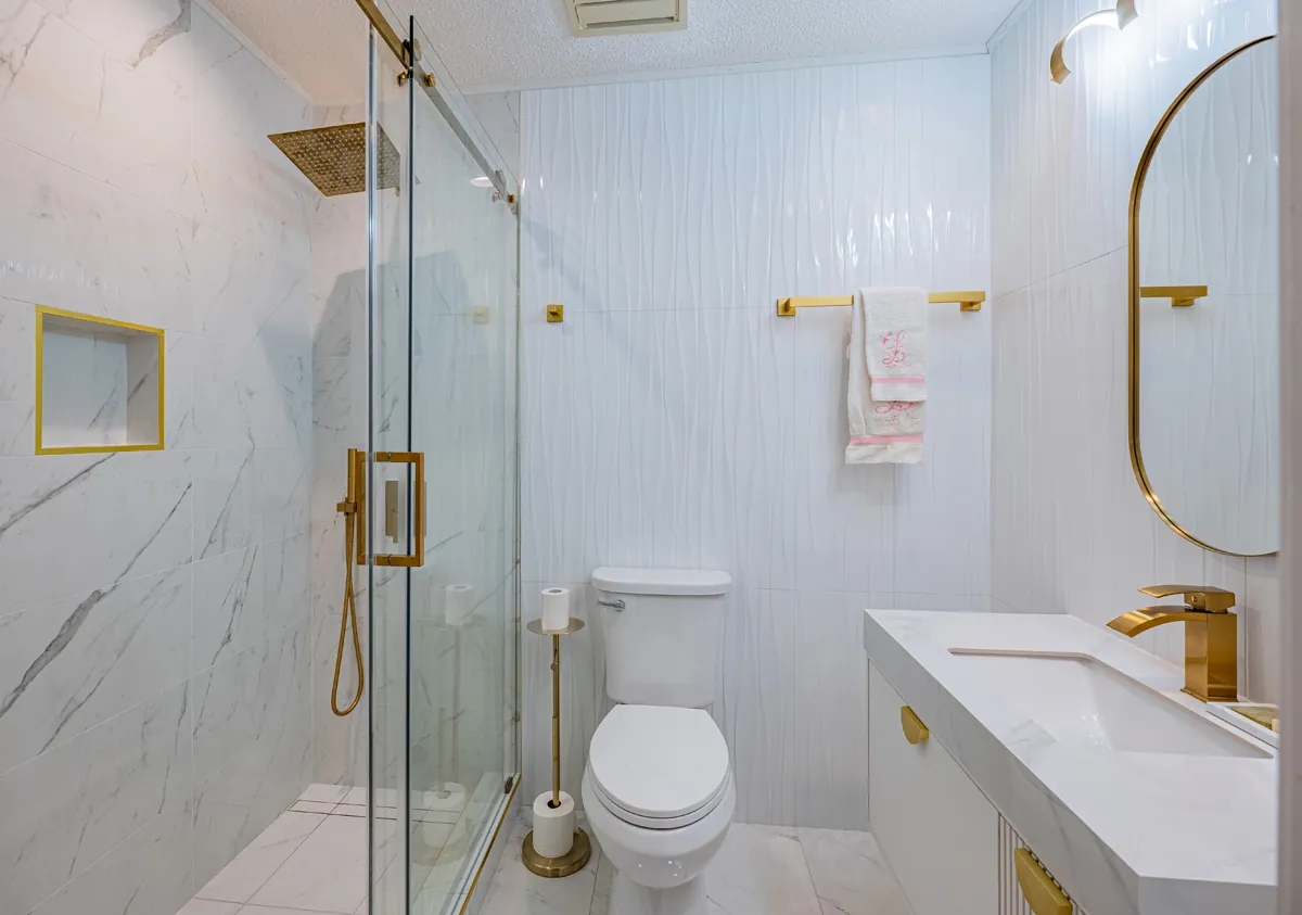 Third bathroom: a glass walk-in shower beside the vanity and toilet