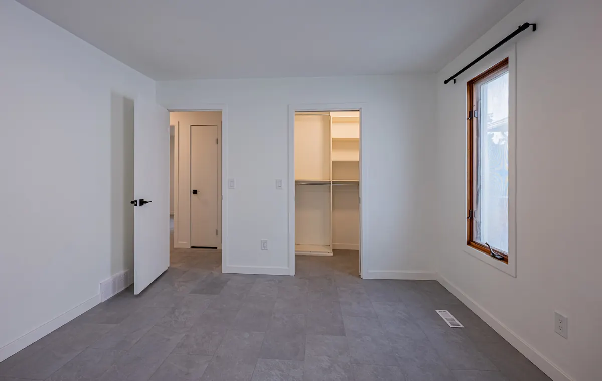 Bedroom doorway onto a walk-in closet with shelving