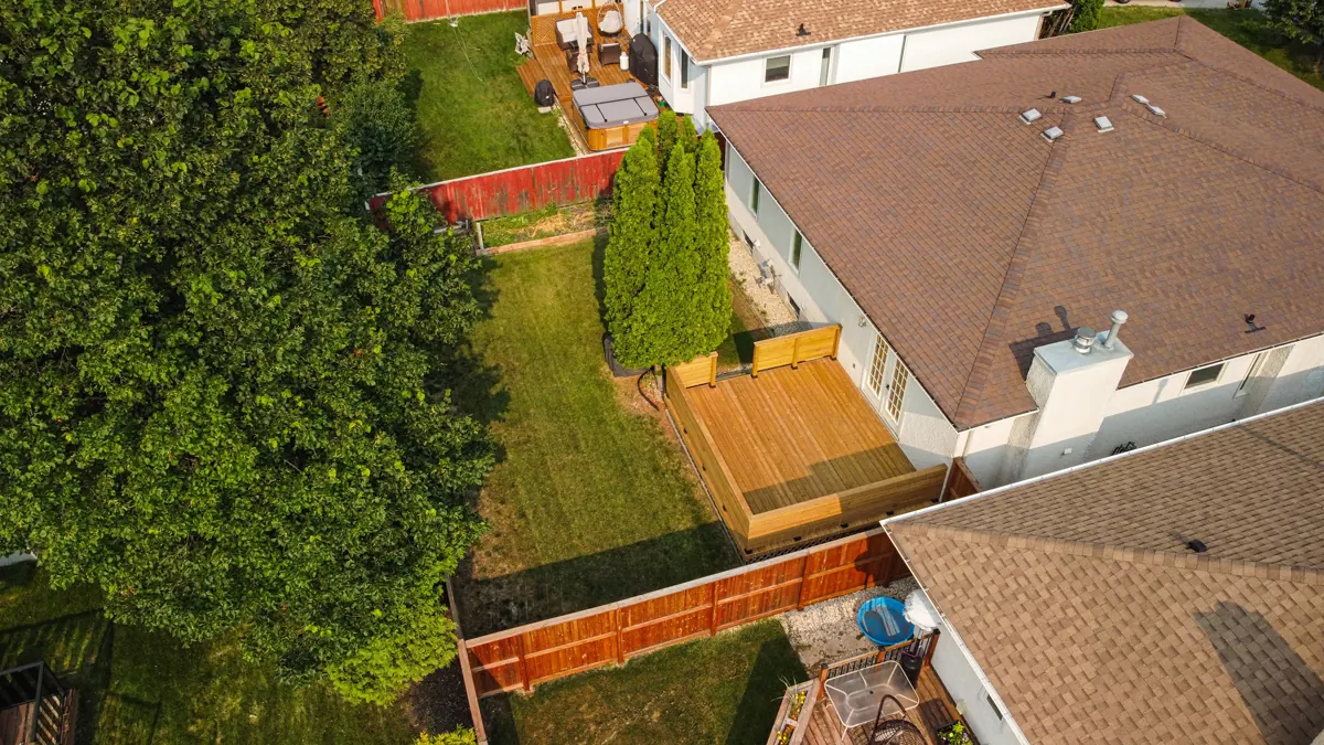 The house from above, the new deck and fence in the back yard