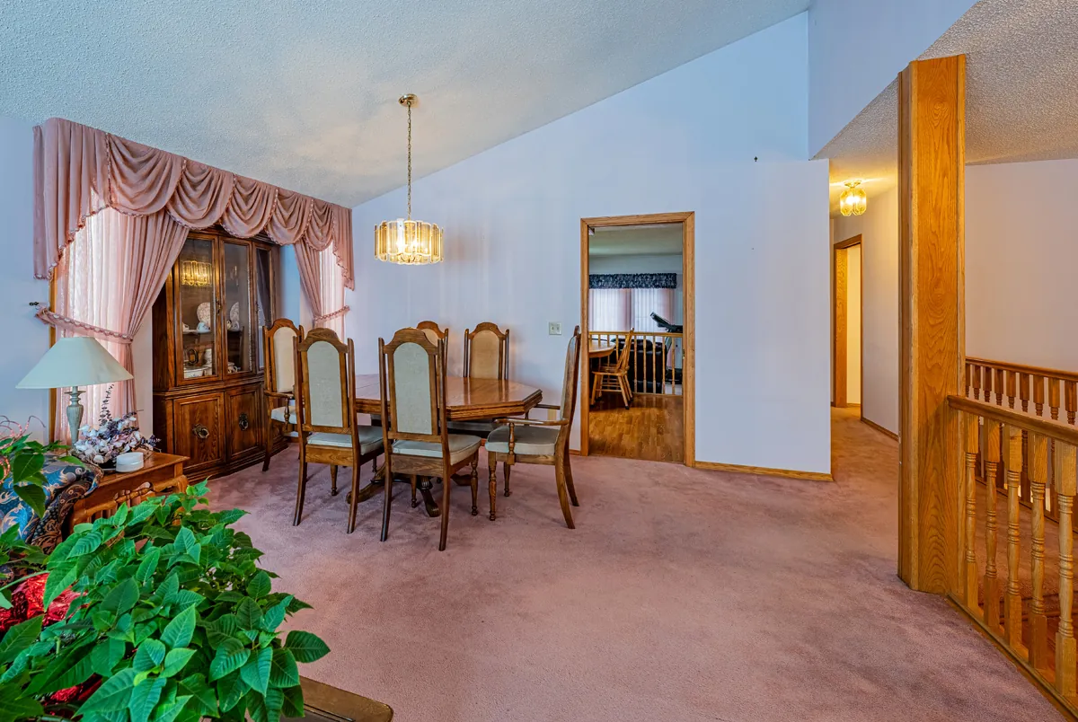 Before: the dining room beside the open stair rail