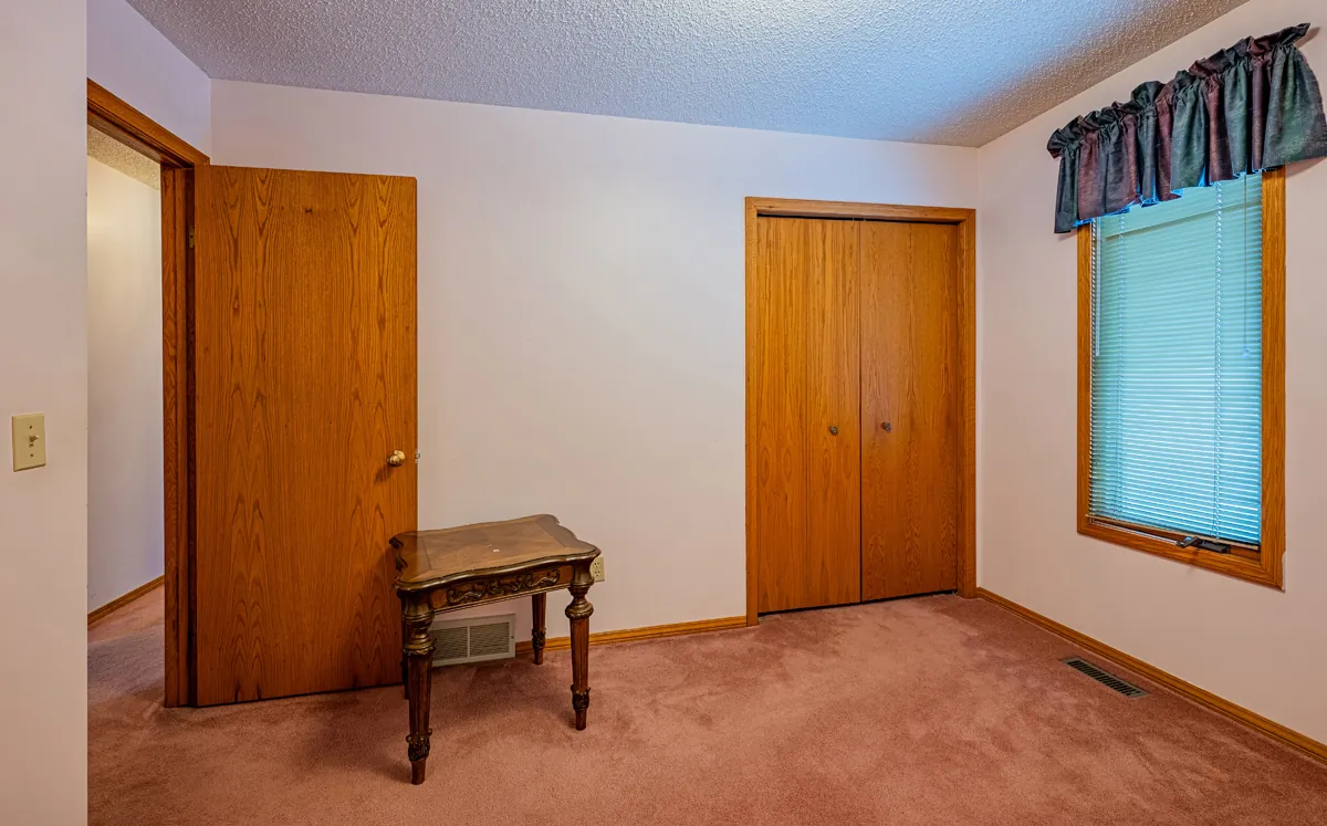 Before: a bedroom with its double closet