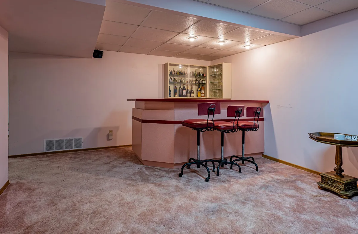 Before: the basement bar under a dropped ceiling