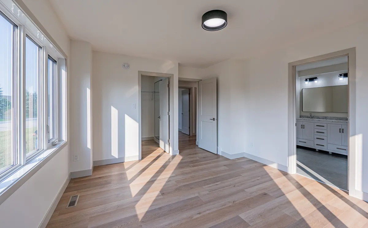 Sunlit bedroom looking out to the hall