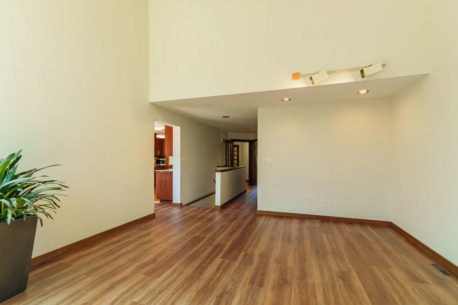 Looking down the hall to the main rooms, floor carried through